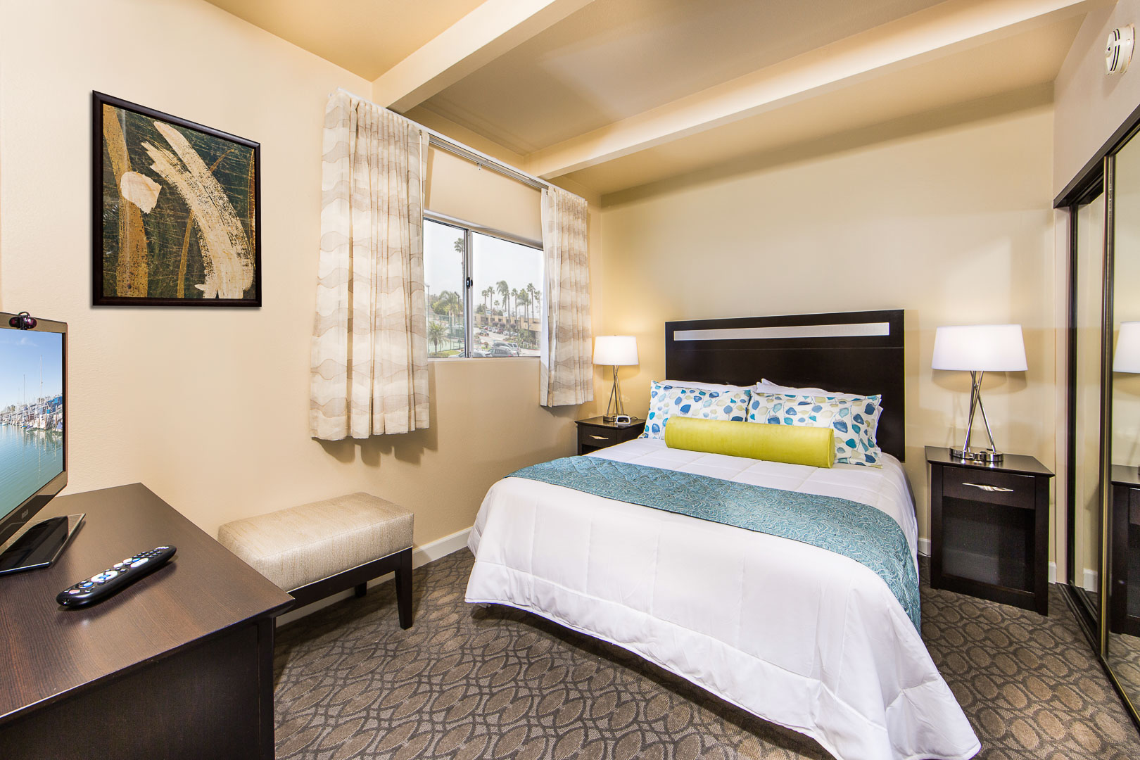 An airy master bedroom at VRI's San Clemente Inn in California.